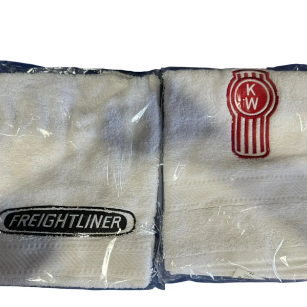 Two white towels with 'FREIGHTLINER' text and a red and gray logo on the bottom, packaged in clear plastic.