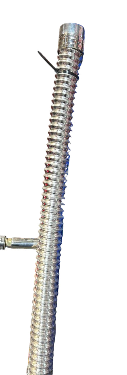 Metallic flexible conduit on a blue metal shelf in a workshop setting